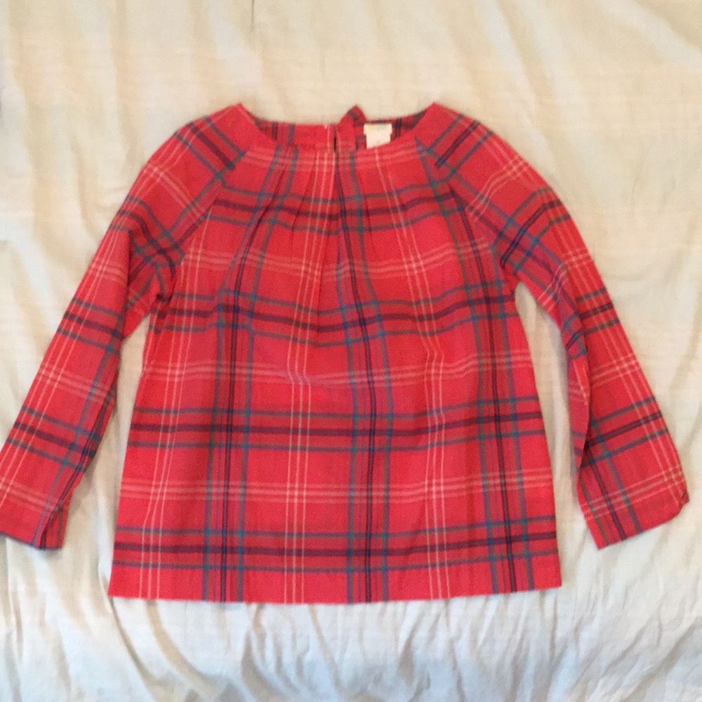 Cute NEW orange/red blouse with a bow on the back